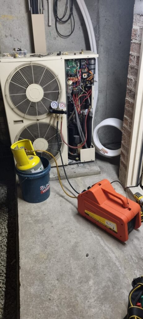 Technician servicing a unit